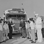 Mouseketeers help Walt Disney christen the Disneyland Express Bus, November 19, 1955